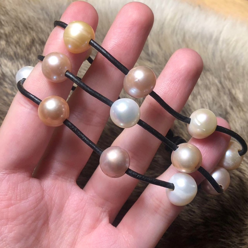 Genuine peachy pink pearl three strand black leather bracelet